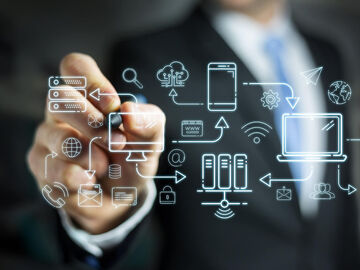 Logistics IT Solutions A businessman who uses a digital wall to show how logistics IT solutions can be used