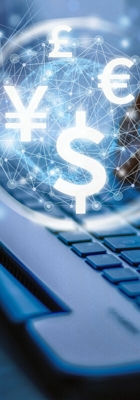 SOC Services - Lower costs Two hands type on a laptop with various currency symbols hovering above it to visualize the cost savings from T Business's SOC services.