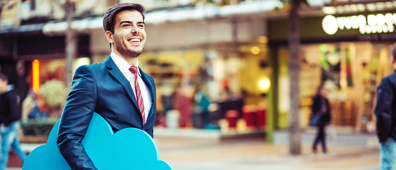 Cloud Computing A smiling businessman carries a stylized cloud under his arm and symbolizes the simplicity of cloud computing, a T Business solution.