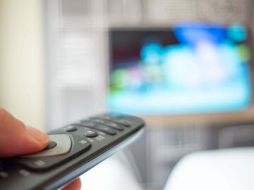 Hospitality IT Solutions A TV remote condition that is used to search for hospitality IT solutions