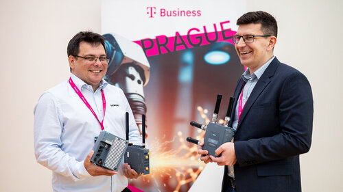 Digital Transformation of Manufacturing Industry Speaker smiling and showing technology at Digital Transformation of Manufacturing Industry
