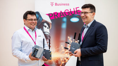 Digital Transformation of Manufacturing Industry Speaker smiling and showing technology at Digital Transformation of Manufacturing Industry