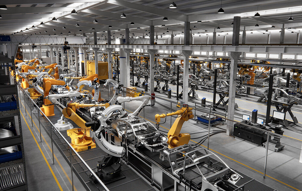 Cars on production line in a factory managed with IT solutions for enterprises