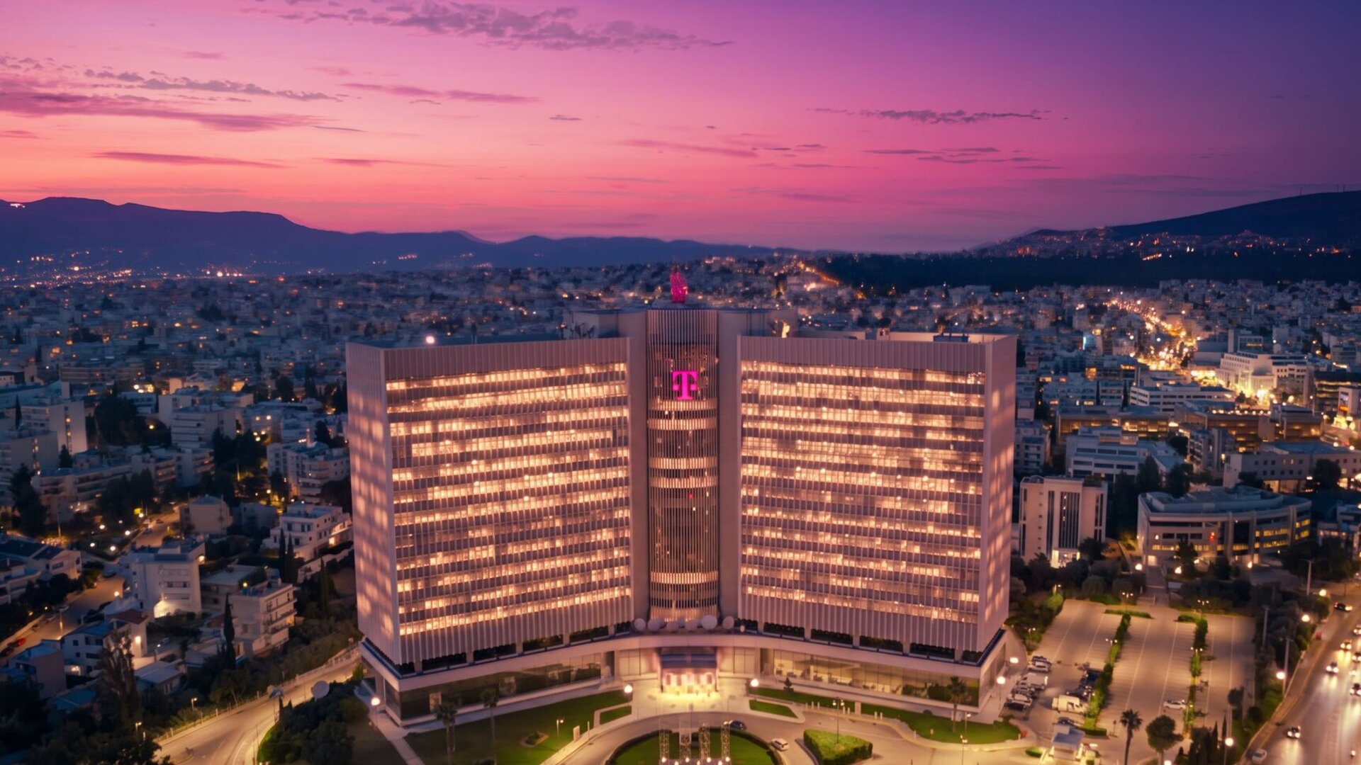 Headquarter in Athen, Greece, at night with the T-logo on the building, representing the rebranding of the brand.
