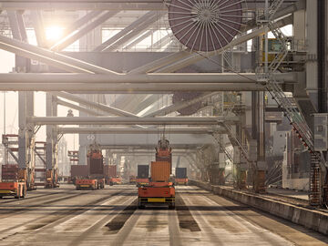 Automated guided vehicle systems, that can also be used for banking and financial solutions, move shipping containers