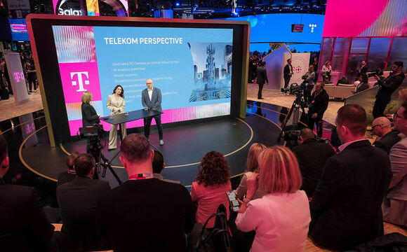 Marijana Bačić, Marin Tica and Mirela Seserko on a stage in front of a large screen titled "Telekom Perspective," which lists bullet points about 5G and AI-enabled workflows at the Mobile World Congress (MWC) 2026.