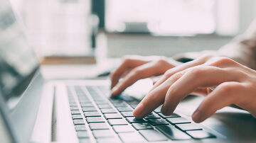 Remote Working Solutions A person working from home thanks to remote working solutions