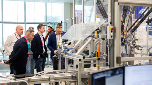 Digital Transformation of Manufacturing Industry Interested visitors taking a look at technology at Digital Transformation of Manufacturing Industry