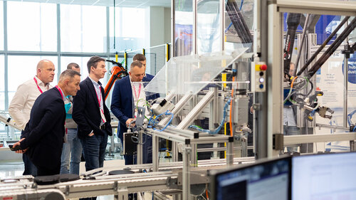 Digital Transformation of Manufacturing Industry Interested visitors taking a look at technology at Digital Transformation of Manufacturing Industry