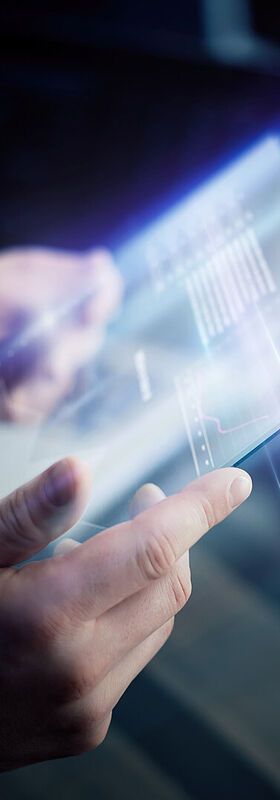 Application modernization A board with rising graphs symbolizes increasing efficiency with application modernization from T Business.