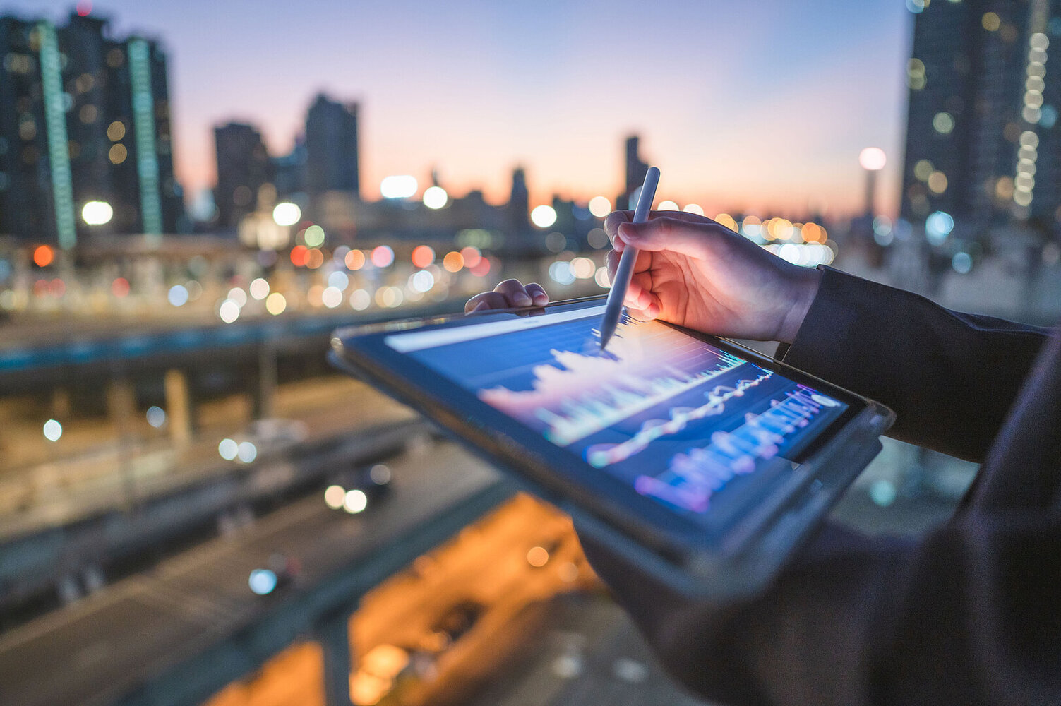 Close-up engineer coding digital data from a tablet AI representing technology trends in the finance and banking industry.