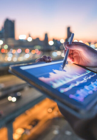Close-up engineer coding digital data from a tablet AI representing technology trends in the finance and banking industry.