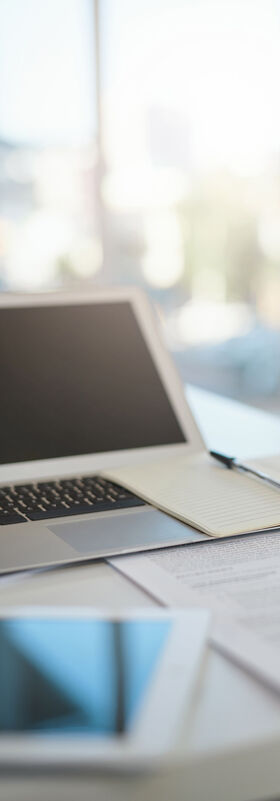 New work A laptop and a tablet on a modern desk, a digital workplace with the new work solutions by T Business.