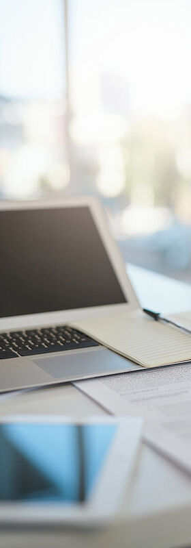 New work A laptop and a tablet on a modern desk, a digital workplace with the new work solutions by T Business.
