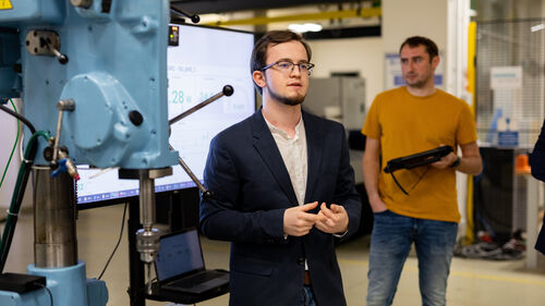 Digital Transformation of Manufacturing Industry A person at the Telekom Business Europe booth at Digital Transformation of Manufacturing Industry