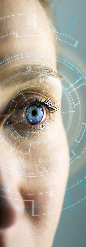 Security risks A woman looks at an augmented reality display to identify security risks using T Business solutions.
