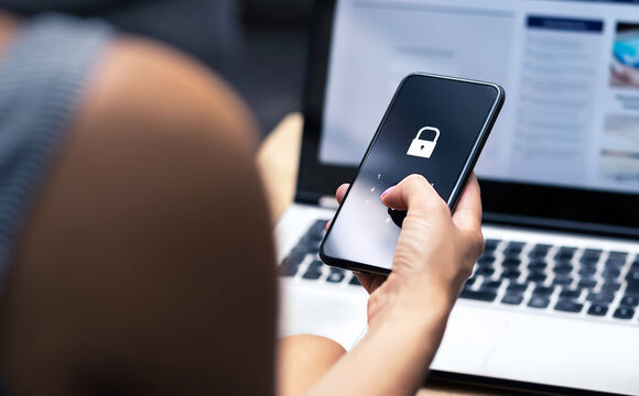 A woman searching on her smartphone for Cisco Meraki
