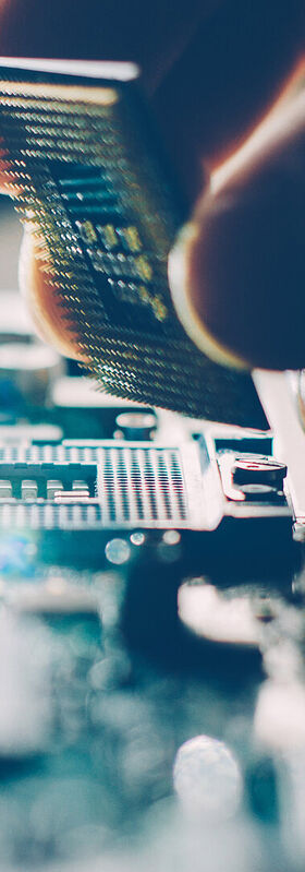 Remote Working Solutions One person assembles a motherboard that can be used for remote working solutions
