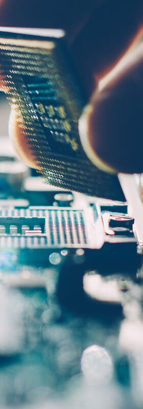 Remote Working Solutions One person assembles a motherboard that can be used for remote working solutions