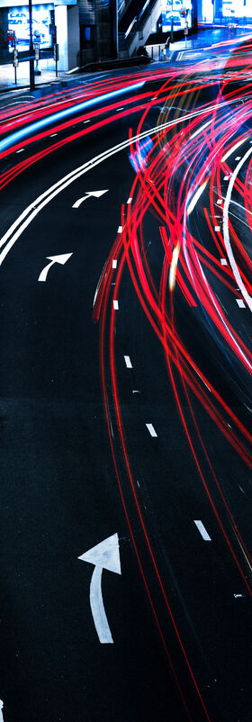 A road with blurred lights from cars symbolizes the governance concept of cloud readiness, a T Business solution.