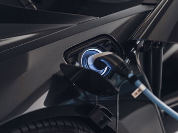 An electric car charging in a smart city