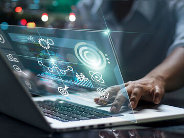 Data scientist using his laptop for analyzing the digital transformation of the government