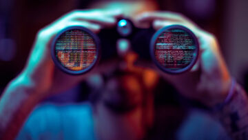 Business IT security A blurred image of a man looking through binoculars with source code visible on the lenses as a symbol for Managed Security Information and Event Management, business IT security solutions by T Business.