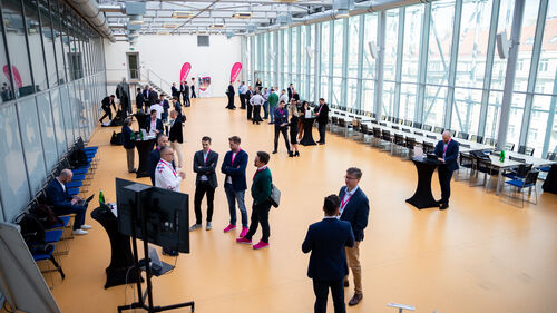 Digital Transformation of Manufacturing Industry Visitors at Digital Transformation of Manufacturing Industry waiting in the entrance area