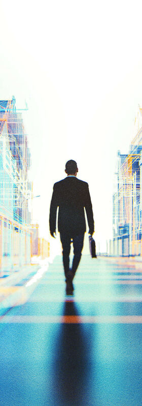 Hospitality IT Solutions A man walking through a virtual street with various hospitality businesses that are looking for IT solutions