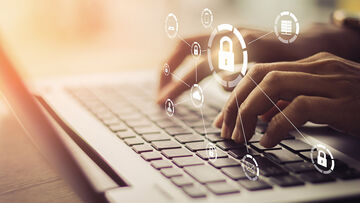 Data security Data security symbols are shown on a keyboard being typed on to visualize T Business data security solutions that enhance email security.