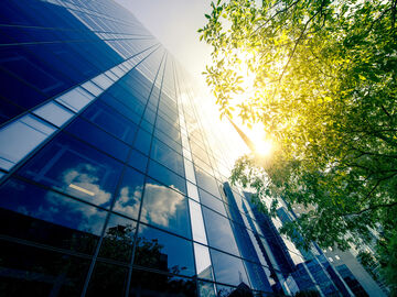 Office skyscraper of a smart city with reflections in the sunlight
