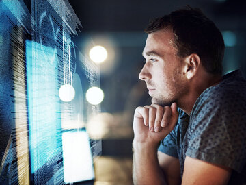 Logistics IT Solutions Man looking on a display while searching for logistics IT solutions