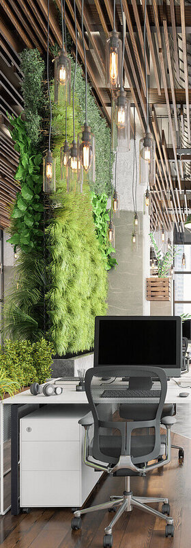 An open-plan office with lots of green plants and modern LED lighting visualizes sustainable digitalization solutions from T Business.