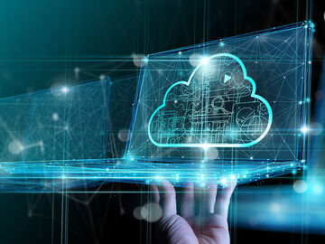 A hand showing a laptop with an abstract cloud with connected dots and lines representing the digital transformation of the government