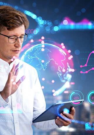 5G Connectivity in Hospitals A man in a white shirt and glasses with a tablet in his left hand. With his right hand, he projects a fluorescent globe over the tablet and numerous other fluorescent numbers and statistics surround him.