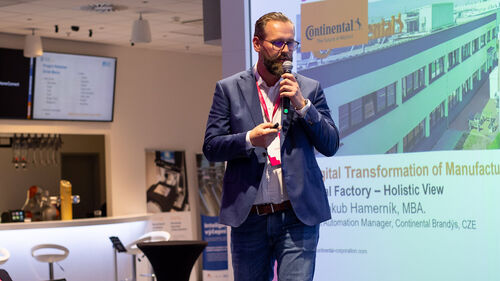 Digital Transformation of Manufacturing Industry Jakub Hamernik speaking at the Telekom Business Europe booth at Digital Transformation of Manufacturing Industry