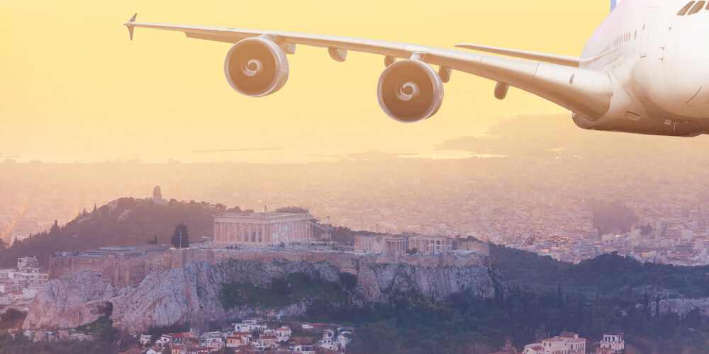 Front view of jet airplane mid air in Athens, Greece