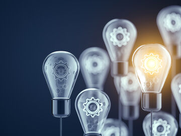 Microsoft Azure Light bulbs with gear wheels in it symbolize active directory managed services with Microsoft Azure, a service from T Business.