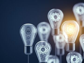 Microsoft Azure Light bulbs with gear wheels in it symbolize active directory managed services with Microsoft Azure, a service from T Business.