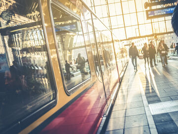 Train station of a smart city with people