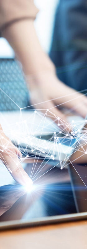 IoT ecosystem Smart devices on a desk with networks stylized above to illustrate how the optimal IoT ecosystem can be constructed with solutions from T Business.