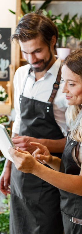 Online Marketing For Small Business Two employees of a garden center talking about the online marketing of their small business